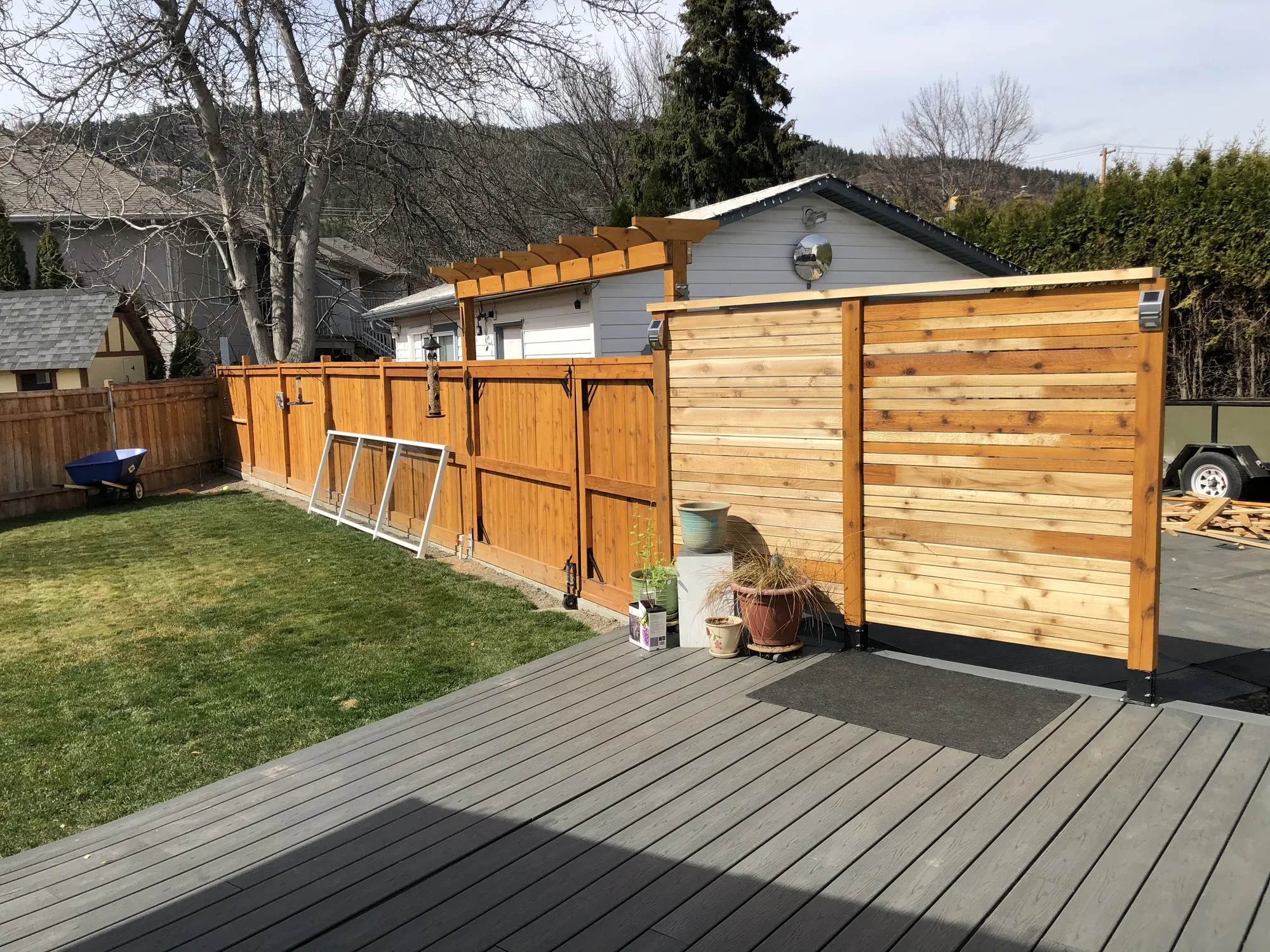 Long cedar privacy fence run in a backyard